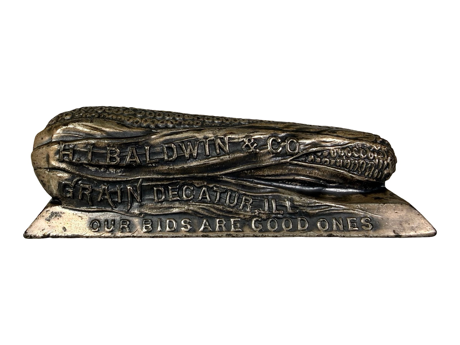 H. I. Baldwin & Co. - Grains - Advertising Paperweight - Lead: Decatur, IL - Circa 1920's. 1 1/8" Tall x 4" Wide. The Peirce Collection.