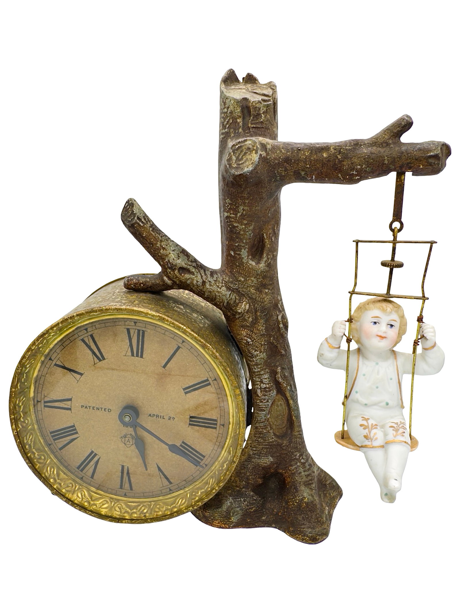 Mantle Clock with Child on Swing: Made of Lead, Glass & Bisque. New York - Circa 1889. 8" Tall x 7 1/4" Wide. This is a very delicate, articulated clock in wonderful paint.