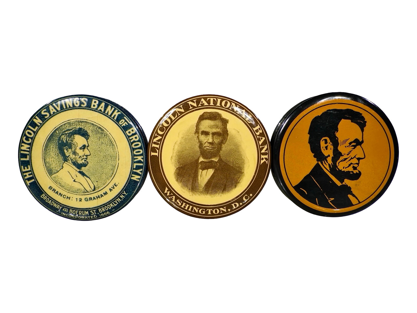 Three Celluloid Pocket Dime Banks: Abraham Lincoln Images. American - 1920's - 2 1/2" Circular. The Peirce Collection.