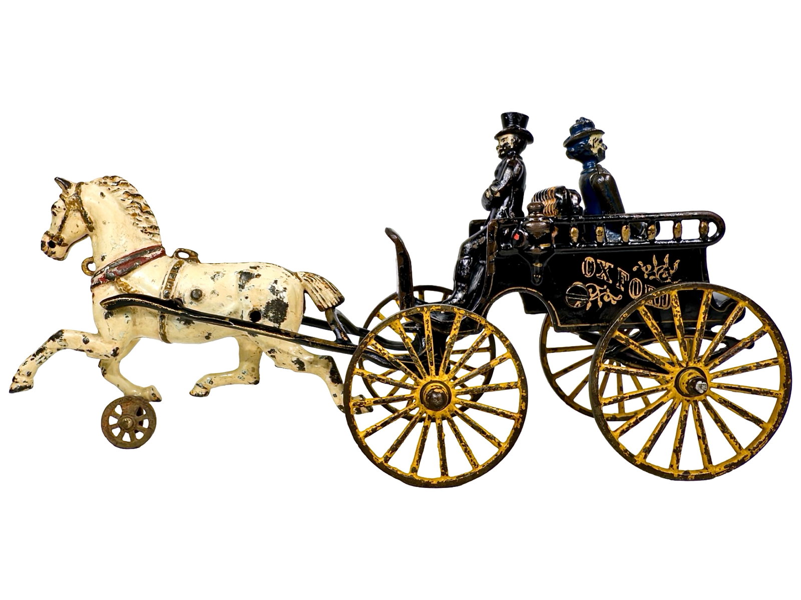 Rare Oxford Trap Carriage - Cast Iron Toy: By the Kenton Hardware Company. Kenton Ohio - Ca. 1900 - 13" Long. The trap carriage is a light-weight horse drawn pleasure vehicle, typically featuring two passenger seats placed back-to-back. Among
