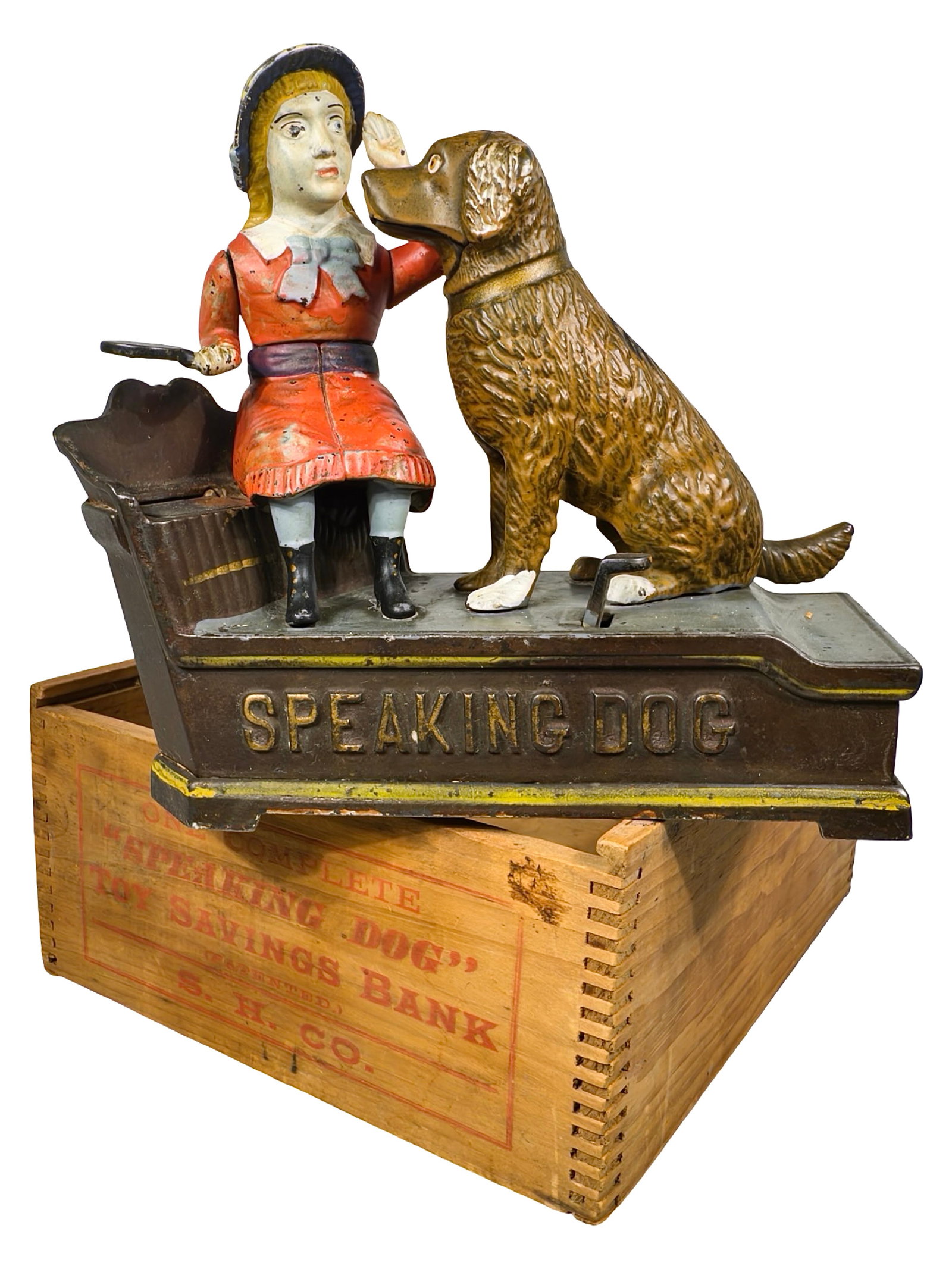 Speaking Dog - Red Dress - Cast Iron Mechanical Bank: By J. & E. Stevens Company. Cromwell, Ct. - Circa 1890's. Comes with a Shepard Hardware Box. The Peirce Collection.