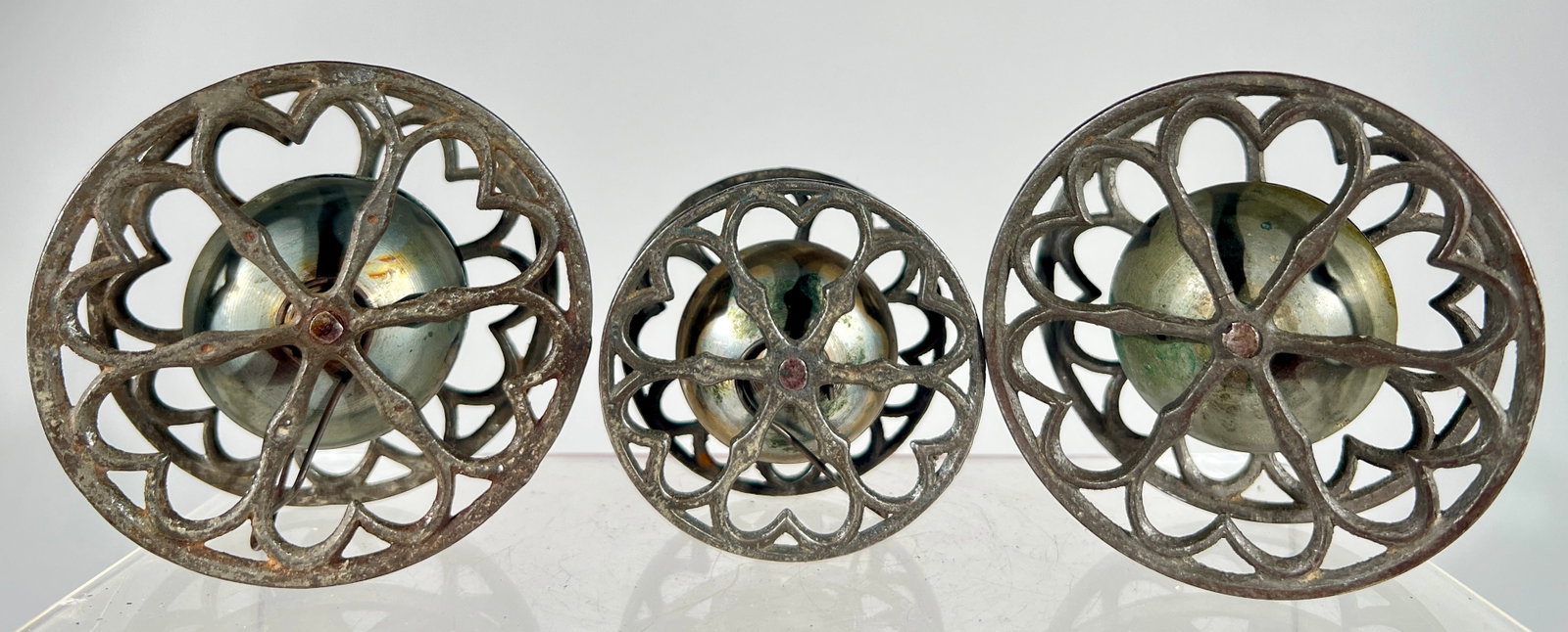 Three Bell Toys: Between Wheels Gong Bell- 1890- Tallest is 3 3/4"
