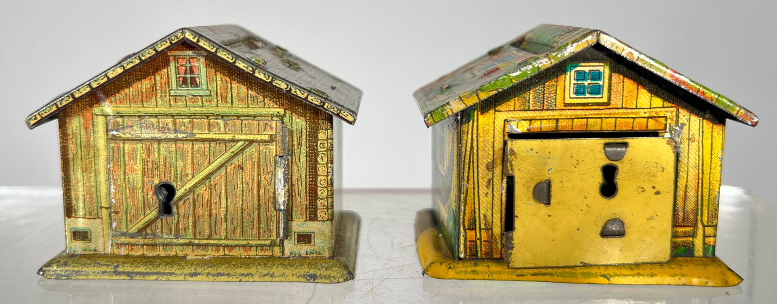 Penny House and Chalet Banks- Key Lock Trap: German- 1920's- 2 1/2"L. The Pierce Collection.