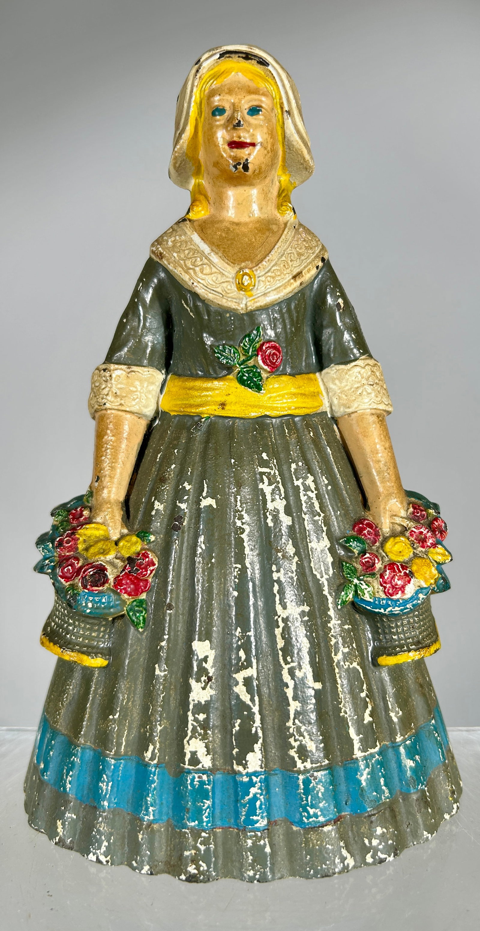 Girl with Flower Baskets Cast Iron Doorstop (1 of 2)