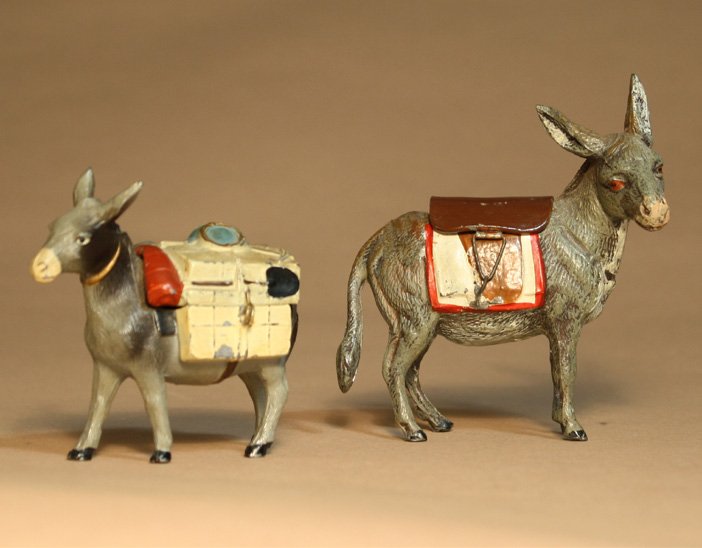 Lot: Two Donkey Items: German Ð Circa 1925 Ð 1935 One with head facing right is 3 1/2Ó long, the other outfitted for a mining expedition is a ring holder. Material: Spelter Reference: PGSB# 395 and 414