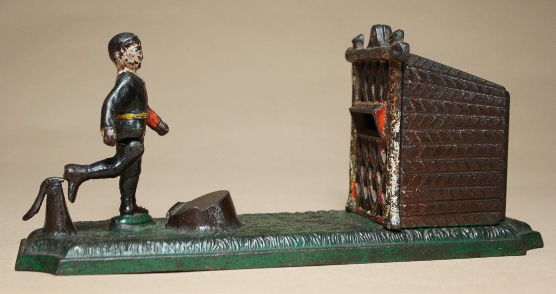 Football Bank: Made by John Harper and Company Willenhall, England Ð Circa 1895 Depicts a soccer player kicking at a goal. The bank works best with old British copper pennies. Material: Cast Iron