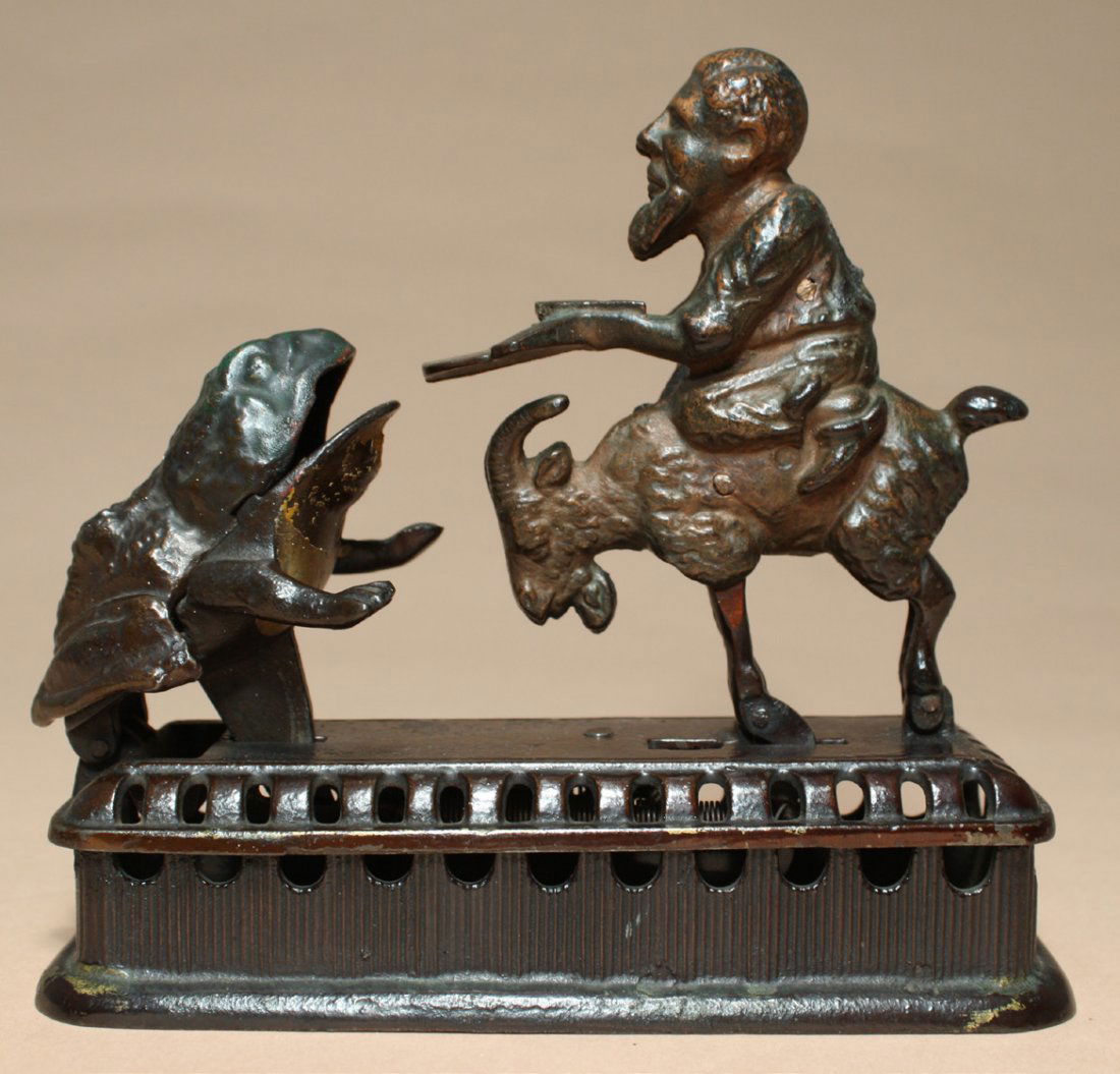 Goat, Frog and Old Man: Made by Mechanical Novelty Works New Britain, Connecticut Ð Circa 1885 Also known as the ÒInitiating Bank Ð 2nd DegreeÓ. It functions by placing a coin in the manÕs tray and then either pressing