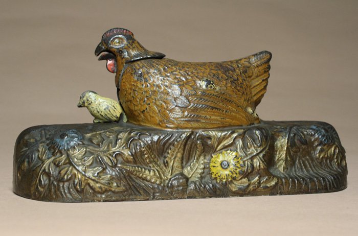 Hen and Chicks Bank, Brown Hen: The J. & E. Stevens Company Cromwell, Connecticut Ð Circa 1901 Another J. & E. Stevens classic bank made circa 1901. Place a coin in the slot in front of the hen. Raise the lever, the hen pecks, a ba