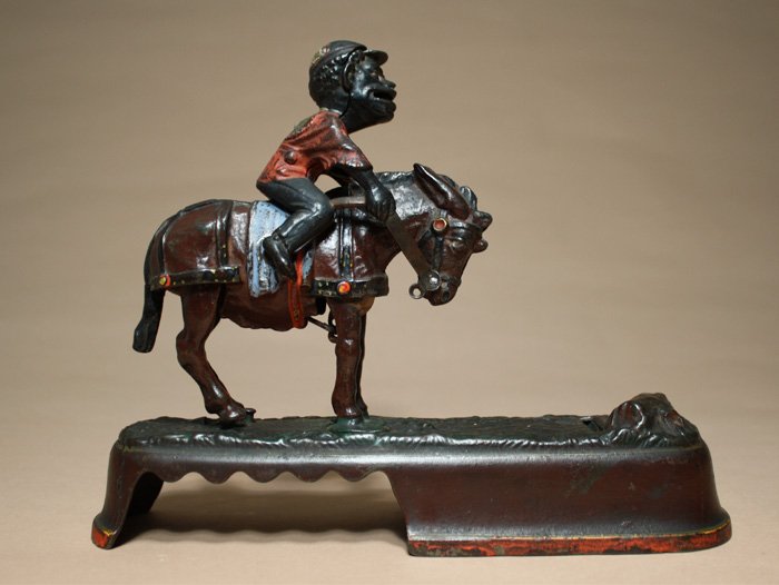 I Always Did ÔSpise a Mule Ð Jockey: Made by J. & E. Stevens Company Cromwell, Connecticut Ð Circa 1895 Place a coin in the JockeyÕs mouth. Press the lever and the mule throws the jockey. The coin is deposited to the tree stump. Materi
