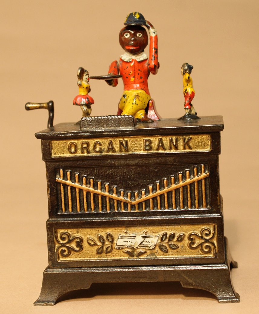Organ Bank, Boy and Girl: Kyser & Rex Company Philadelphia, Pennsylvania Ð Circa 1882 The monkey doffs his hat in thanks for the penny you have given him. The children rotate and the bells chime when the crank is turned. Mate