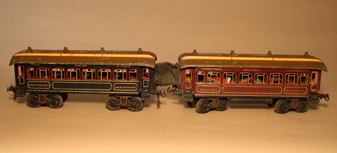 Lot: Compagnie Internationale Train Cars Ð Gauge I: Gebuder Bing German Ð Circa 1915 A dining car in blue and a sleeping coach in brown. They are Gauge I and each is 13Ó long. Material: Tin