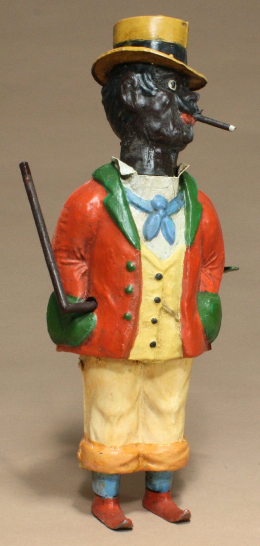 Hand Painted Black Dandy: Gunthermann Germany Ð Circa 1905 This is a magnificent hand painted toy that we have previously not seen. His cane revolves and his head turns back and forth. It is 9Ó tall and works well. Great loo