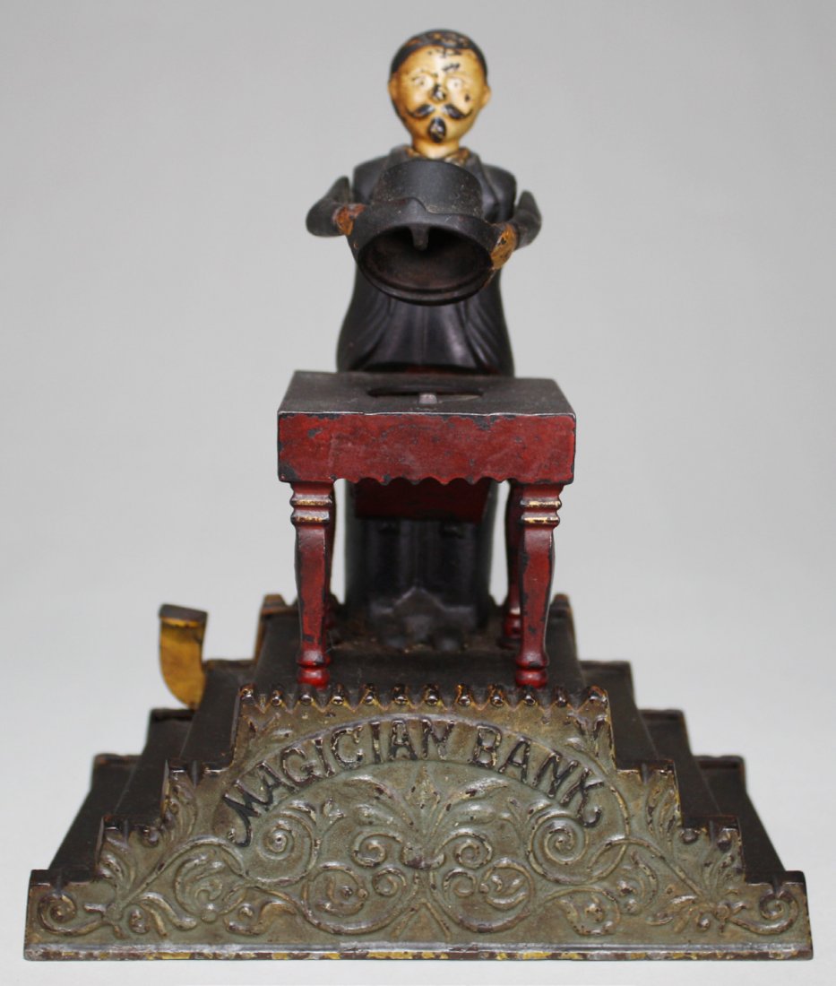 Magician Bank: Made by J. & E. Stevens Cromwell, Connecticut Ð Circa 1901 ÒNow you see it, now you donÕtÓ. So goes the action of the ever-popular Magician Bank. It is one of the most beautifully designed banks e
