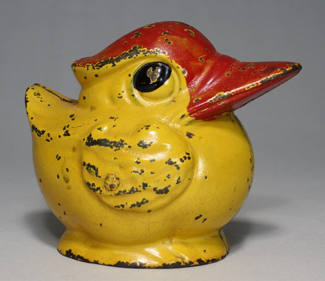 Round Duck Ð Yellow: Kenton Hardware Kenton, Ohio Ð Circa 1930 A scarce and desirable bank. It retains its trap. Material: Cast Iron
