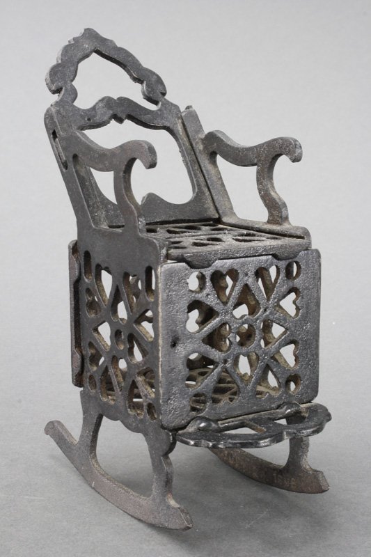 Rocking Chair Still Bank: C. J. Manning Designer Probably, Ives, Blakeslee Co. Connecticut - Circa 1898 This is a rare and highly desirable bank. This one is complete without any cracks; quite amazing considering its fragility