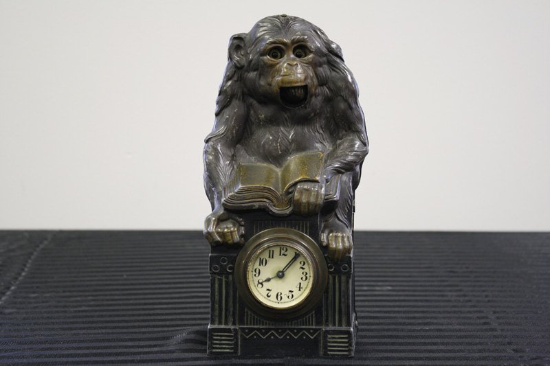 Blinking Eye Monkey: American - Circa 1920’s This is a wonderful mantle clock from the 1920’s. It depicts a monkey that moves his mouth and eyes when wound. It is 9 3/4” tall. He works well. Material: Lead, Brass an