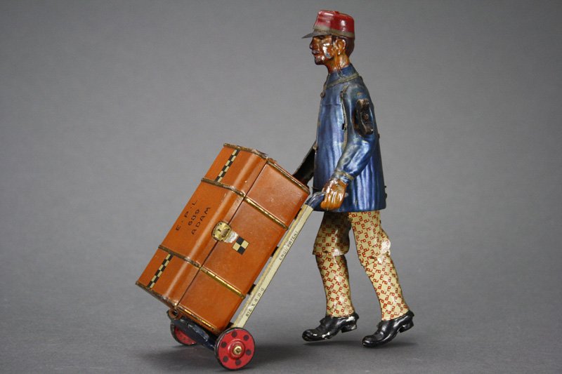 Adam” the Porter: E. P. Lehmann Germany - Circa 1905 This is a very fine, working example of “Adam” the Porter. He retains his original trunk. Material: Tin