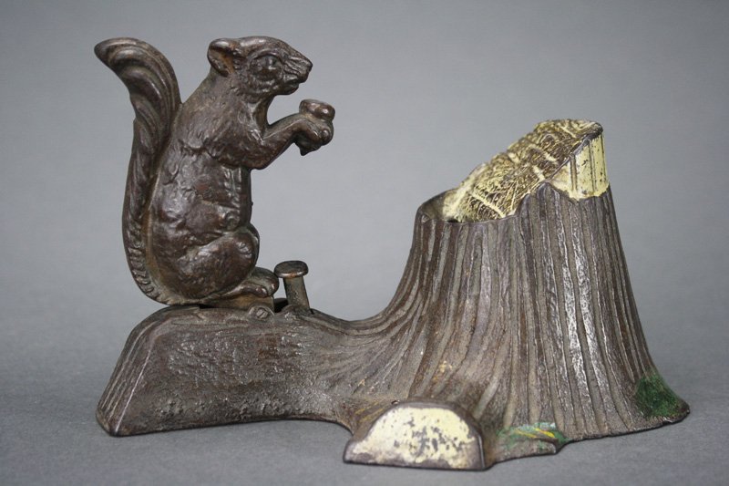 Squirrel and Tree Stump Mechanical Bank: Made by Mechanical Novelty Works New Britain, Connecticut – Circa 1880 Like the squirrel who saves acorns in a hollowed out tree stump, the child who saves pennies will turn them into dollars and th