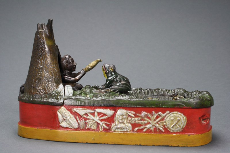 Chief Big Moon Bank – Red Mechanical Bank: Made by the J. & E. Stevens Company • Cromwell, Connecticut – Circa 1899 Charles Bailey’s inspiration for “Chief Big Moon” may have come from the frog pond adjacent to the Stevens foundry bu