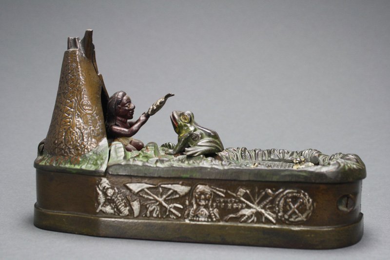 Chief Big Moon Bank – Tan Mechanical Bank: Made by the J. & E. Stevens Company • Cromwell, Connecticut – Circa 1899 Charles Bailey’s inspiration for “Chief Big Moon” may have come from the frog pond adjacent to the Stevens foundry bu