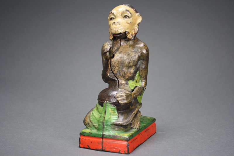 Monkey and Coconut Bank Mechanical Bank: Made by the J. & E. Stevens Company Cromwell, Connecticut – Circa 1886 Place the coin in the monkey’s hand and press the lever behind the monkey. He will take your penny and make it disappear in h