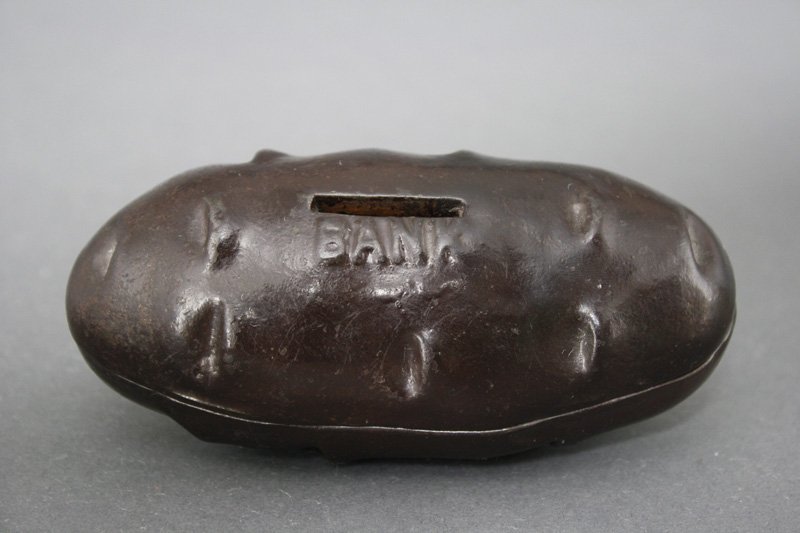 Potato Bank Still Bank: Mary A. Martin Designer American - Circa 1897 This is a rare still bank in superior condition. It is one of the best we have seen. Material: Cast Iron
