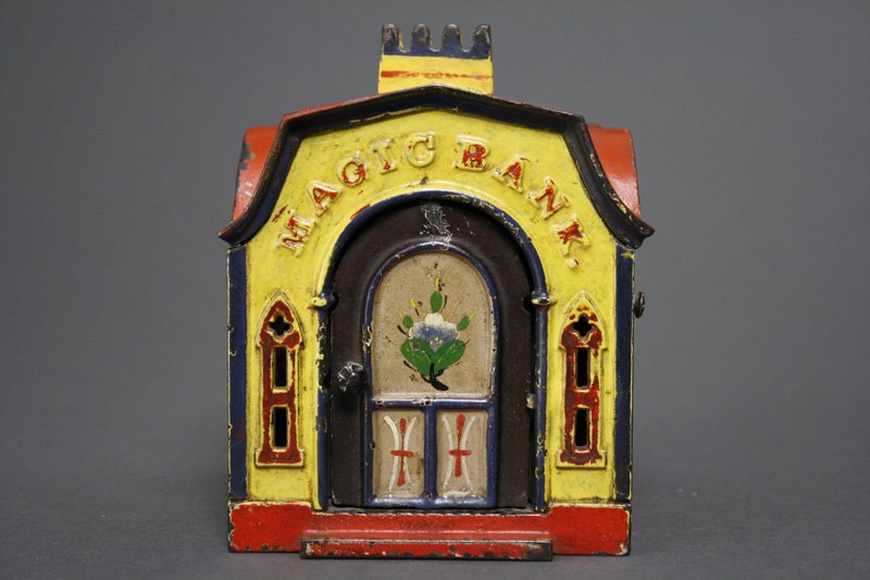 Magic Bank Yellow Mechanical Bank: J. & E. Stevens Cromwell, CT - Circa 1876 Material: Cast Iron Provenance: Bill Robison Collection