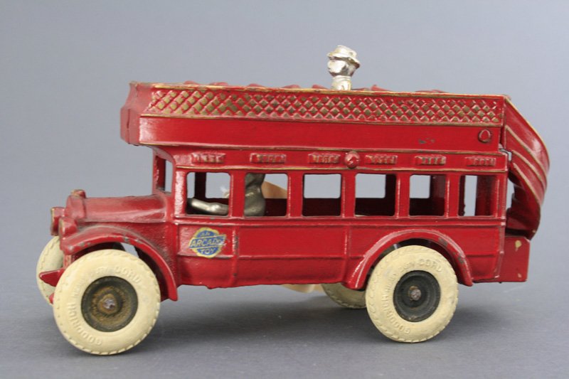 Double Decker Bus Cast Iron Arcade: Arcade Mfg. Co. Freeport, Illinois - Circa 1928 This is a scarce bus made by Arcade. It is in superior condition and is certainly one of the finest known examples. It is 8 1/4" long. It retains its pa
