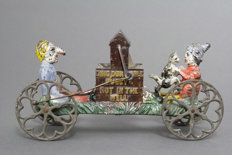 Ding Dong Bell Toy Gong Bell: Gong Bell Mfg. Co. Connecticut - Circa 1890 This toy depicts the nursery rhyme Ding Dong Bell, Pussy's Not in the Well. 9" long. Material: Cast Iron
