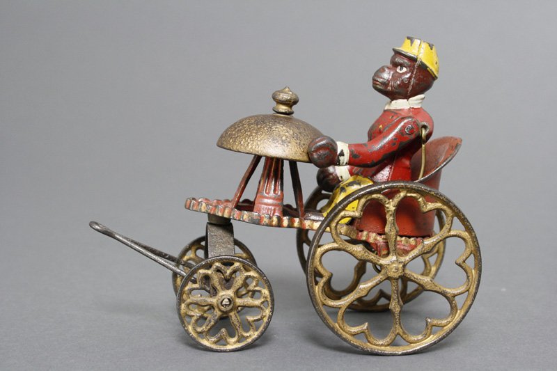 Monkey in Chariot Bell Toy Kyser & Rex: Kyser & Rex Philadelphia, Pennsylvania - Circa 1880's Material: Cast Iron