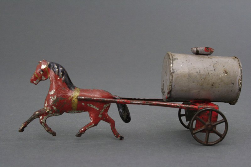 Water Sprinkler American Tin: James Fallows Philadelphia - Circa 1880 Mauve and red with a brown horse. 8" long. Material: Tin