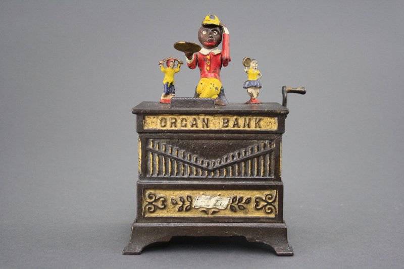Organ Bank, Boy and Girl Mechanical Bank: Kyser & Rex Company Philadelphia, Pennsylvania - Circa 1882 Material: Cast Iron