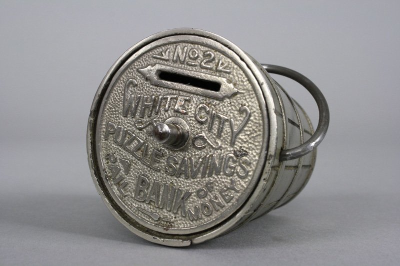 White City Puzzle Safe #2 Still Bank: Nicol & Co. Chicago, Illinois - Circa 1893 This example is Near Mint and retains a complete operating label underneath. The Chicago World Fair was called “White City”. Material: Cast Iron
