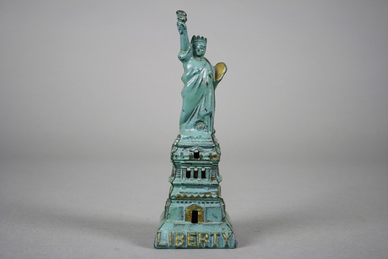 Statue of Liberty, Medium - Aqua Blue Architectural: Kenton Hardware Kenton, Ohio - Circa 1915 The scarce aqua blue version of the bank. It is a superior example of the bank. Material: Cast Iron