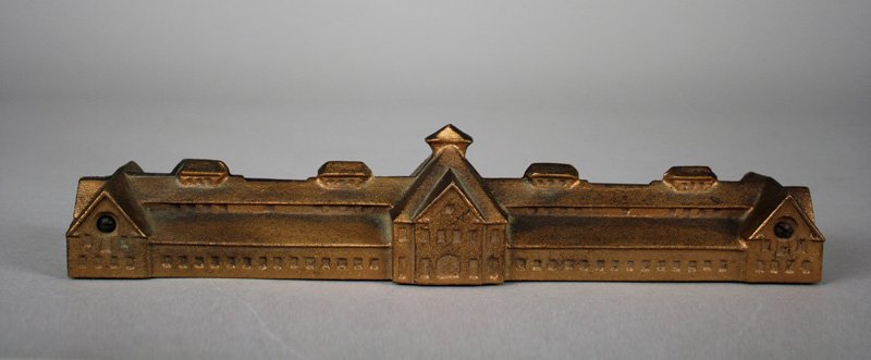 McKinney Stables Architectural Bank: Unknown Maker American - Circa 1960’s This is a very scarce modern building bank. McKinney Stables was built in 1909. Cuba, New York is about 100 miles south of Rochester. It was the home of Johar A
