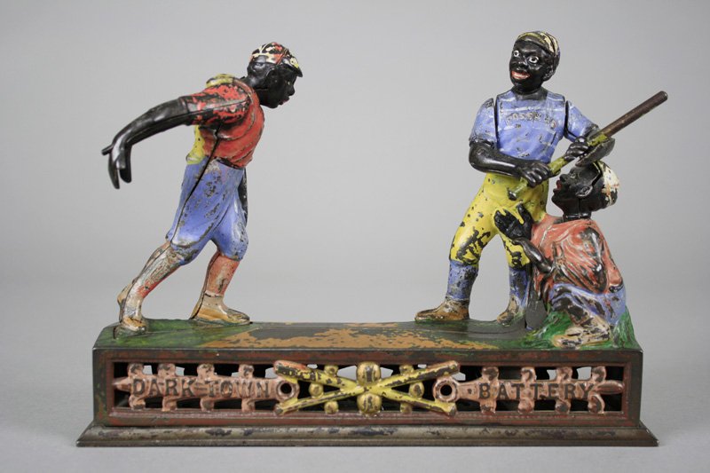 Darktown Battery Mechanical Bank: Made by the J. & E. Stevens Company Cromwell, Connecticut - Circa 1888 Place a coin in the pitcher’s hand and press the lever. He pitches the coin and the batter swings, but the coin sails so quickl