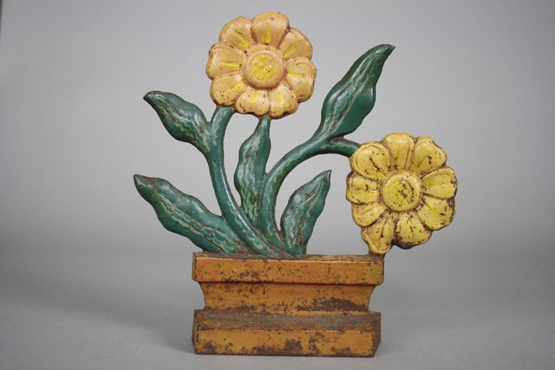 Modernistic Flowers Cast Iron Doorstop: American - Circa 1920 - 10” tall Material: Cast Iron