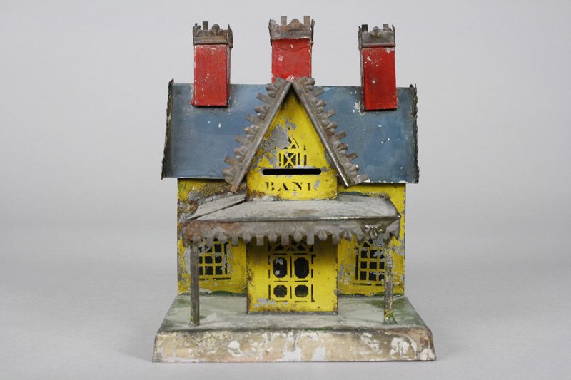 Gothic House with Three Chimneys American Tin: George Brown Forestville, Connecticut - Circa 1875 The slightly scarce version with three chimneys. It is 6.5” tall x 5” wide x 5” deep. Material: Tin