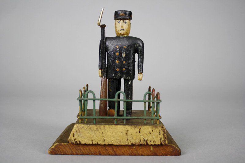 Soldier in his Sentry Post Folk Art: American - Circa 1890’s Powerful small folk carving with great color and design. 6” tall x 5” wide. Material: Wood
