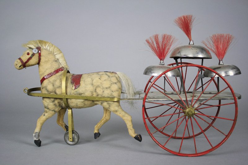 Horse Drawn Bell Toy: Germany - Circa 1905 A colorful and graphic large scaled bell toy (15.5” long) in superior condition. Material: Tin, Felt and Papier Mache