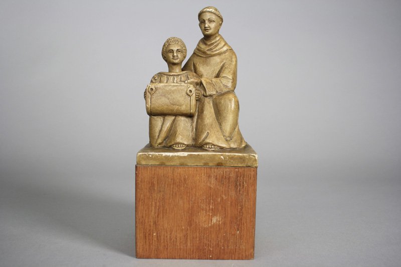 African Mission Alms Box: Germany - Circa 1920 Made of a plaster top and a wooden base. It is about 10” tall. Material: Plaster and Wood