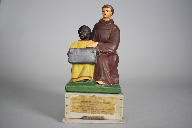 China/Congo Missions Alms Box: Germany - Circa 1930 This appears to be an alms box that was used to raise funds for missions in China and the Belgian Congo. It is 11.25” tall and works well. Material: Plaster and Wood