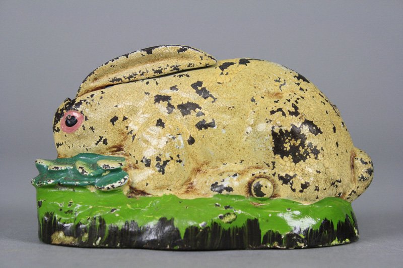 Rabbit in Cabbage Mechanical Bank: Made by Kilgore Mfg. Company Westerville, Ohio - Circa 1925 Press a coin into the coin slot and the rabbit’s ears raise up and lower back down. Kilgore marketed this adorable little bank as “Flopp