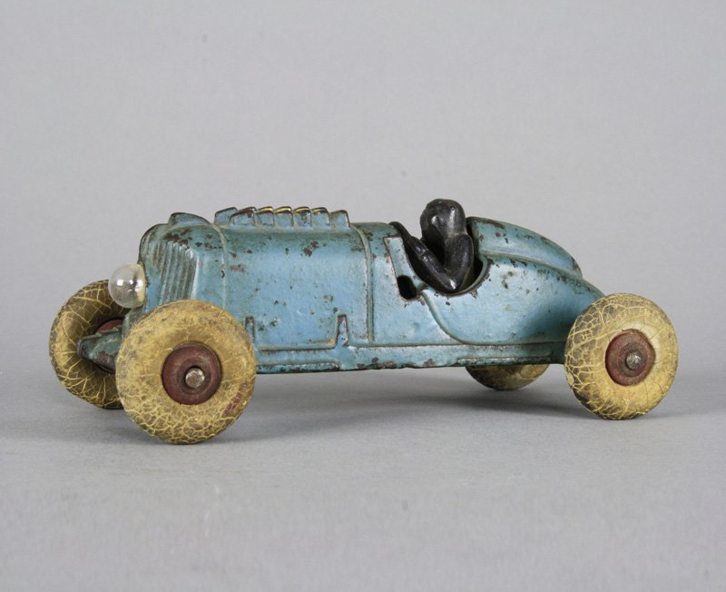 Race Car - Working Light: Hubley Mfg. Co. Lancaster, Pennsylvania - Circa 1935 This toy is scarce and is 6.75” long. Material: Cast Iron