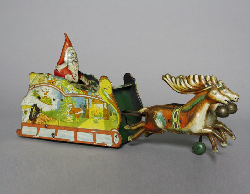 Santee Sleigh: Ferdinand Strauss New York - Circa 1923 This is a classic and colorful Strauss toy. It is 11.25” long and works well. Material: Tin