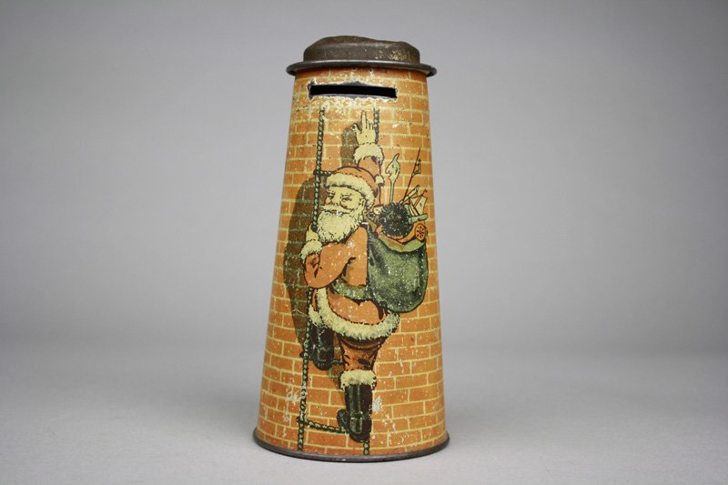 Santa Climbing Ladder: England - Circa 1920’s Haven’t you always wondered how Santa reached your chimney top. Apparently, he leans a ladder against the brickwork and softly and swiftly ascends. 6.5” tall. Material: Ti