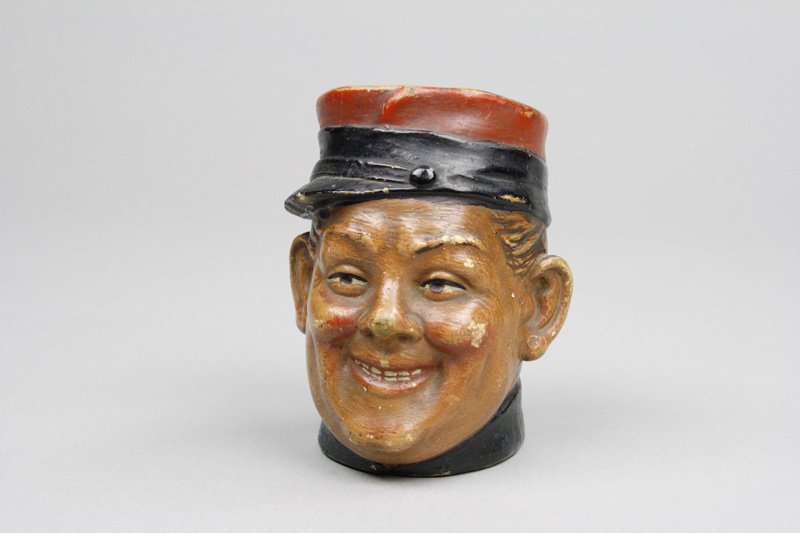 Soldier with Hat Askew: Bernhard Bloch - Model Number 4866 Germany - Circa 1910 This young recruit is 3.5” tall. Material: Earthenware