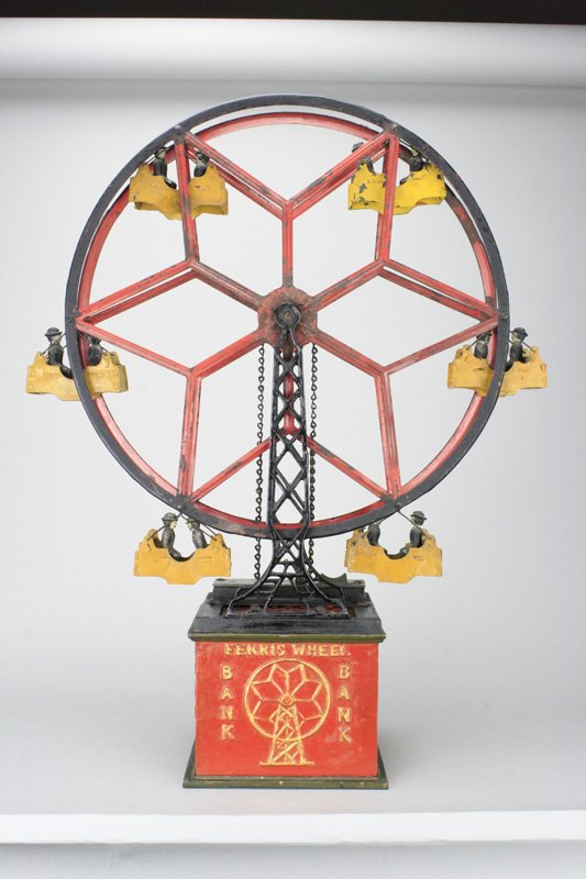 Ferris Wheel Bank Converted Fantasy Creation: Philadelphia, Pa. - Circa 1930’s The Ferris Wheel bank was created by early mechanical bank enthusiasts based upon known patent illustrations. Material: Cast Iron and Sheet Steel