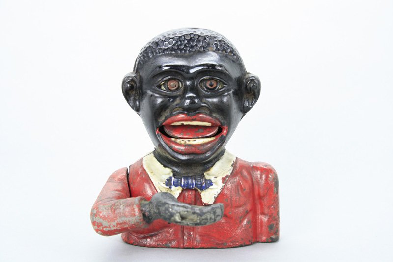 Little Joe Mechanical Bank: John Harper Ltd. Willenhall, England - Circa 1930Material: Cast Iron (Arm Aluminum)