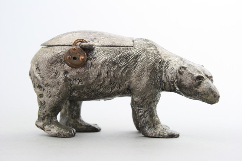 Polar Bear Still Bank: German - Circa 1925 A scarce and finely detailed silver lead bank. Material: Silver Lead